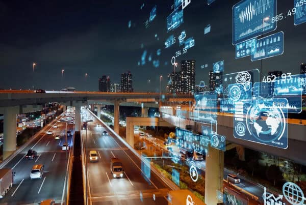 a highway at night with a display of numbers and graphs