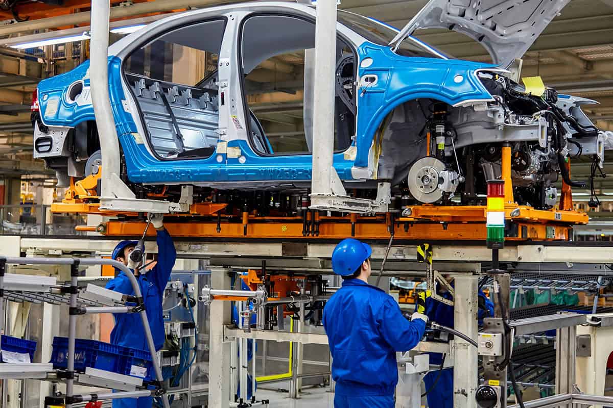 car assembly line representing manufacturing inventory management solution