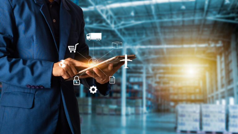 Businessman manager touching icon for logistics on Modern Trade warehouse background